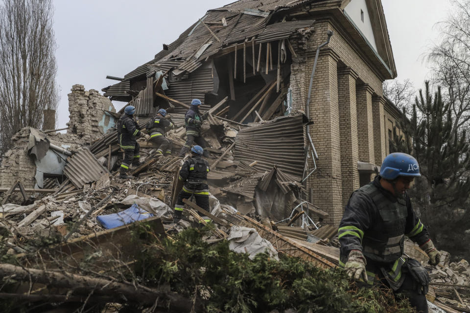 Ukrainian firefighters work at a damaged hospital maternity ward in Vilniansk, Zaporizhzhia region, Ukraine, Wednesday, Nov. 23, 2022. A Russian rocket struck the maternity wing of a hospital in eastern Ukraine on Wednesday, killing a newborn boy and critically injuring a doctor. The overnight explosion left the small-town hospital a crumbled mess of bricks, scattering medical supplies across the small compound. (AP Photo/Kateryna Klochko)