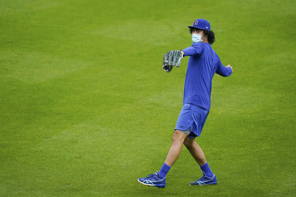 Chicago Cubs starting pitcher Yu Darvish (11), Thursday's scheduled starter, warms up prior to a baseball game against the Cincinnati Reds at Great American Ballpark in Cincinnati, Thursday, July 30, 2020. (AP Photo/Bryan Woolston)