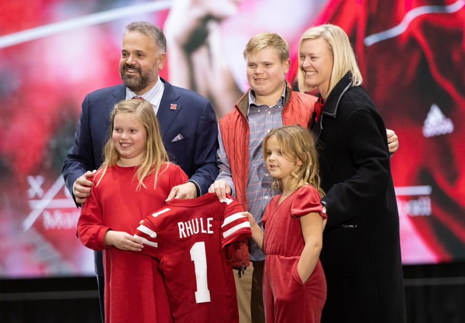 New Nebraska NCAA college football coach Matt Rhule, from left, poses for photos with his family, including his children Vivienne, 9, Bryant, 18, Leona, 7, and his wife, Julie, during an introductory press conference, Monday, Nov. 28, 2022, in Lincoln, Neb. (AP Photo/Rebecca S. Gratz)