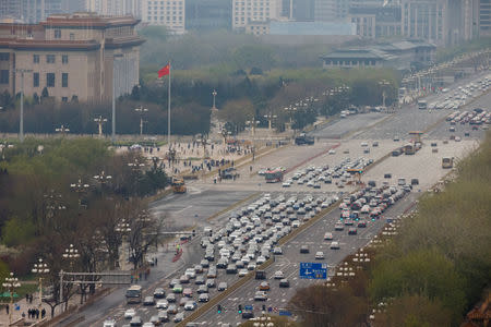 Cars line Chang'an Avenue at Tiananmen Square in Beijing, China April 9, 2019. REUTERS/Thomas Peter