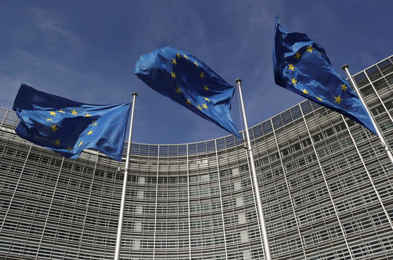 FILE PHOTO: European Union flags flutter outside the European Commission headquarters in Brussels