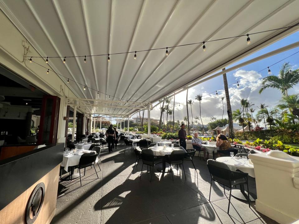 outdoor seating under white awning