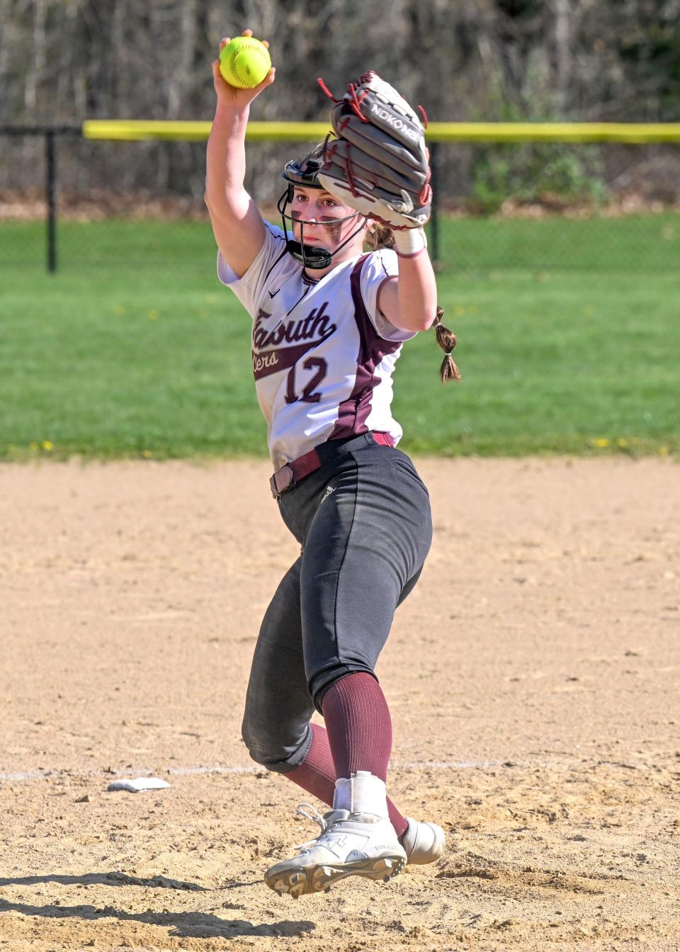 Falmouth starter Rylin Briggs winds up to throw against Barnstable.