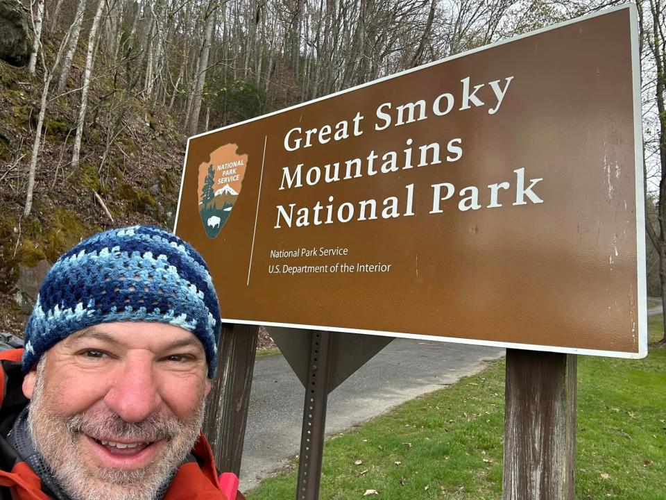 Rob Weisberg takes a selfie in front of a sign for the Great Smoky Mountains National Park, which straddles the border between North Carolina and Tennessee. Weisberg, a volunteer firefighter in New York, spent months hiking the Appalachian Trail before an injury prevented him from completing the journey.