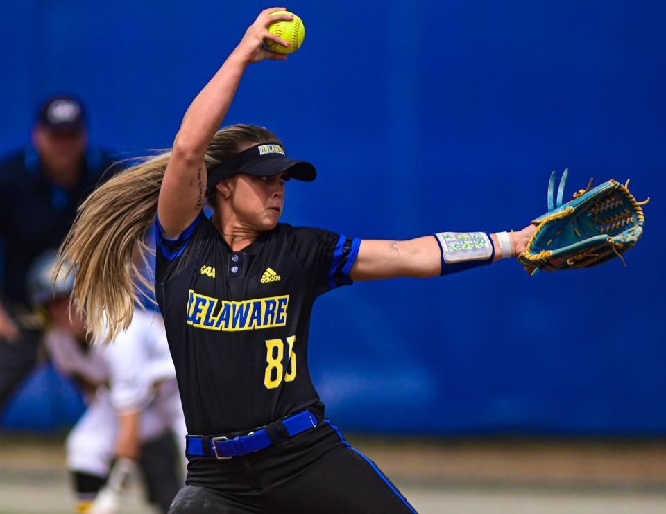 Emily Winburn fires a pitch against Towson.