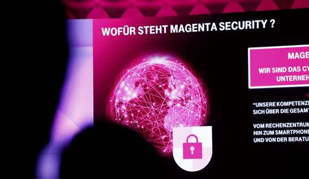 A screen displays "What stands Magenta Security for?" at a Deutsche Telekom "Security in Magenta" congress in Frankfurt, Germany on November 29, 2016. REUTERS/Ralph Orlowski