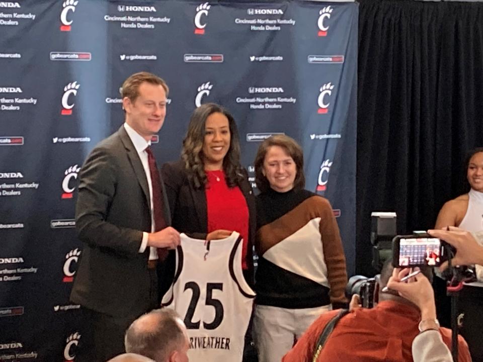 New Cincinnati Bearcats women's basketball coach Katrina Merriweather was introduced Tuesday afternoon at UC's Gravity Club by AD John Cunningham (left). To Merriweather's right is her former coach Laurie Pirtle.