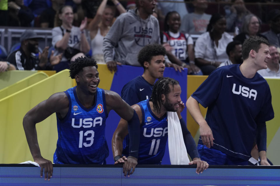 U.S. forward Jaren Jackson Jr. (13) and U.S. guard Jalen Brunson (11) reacts after U.S. forward Paolo Banchero (8) dunking during the Basketball World Cup quarterfinal game between Italy and U.S. at the Mall of Asia Arena in Manila, Philippines, Saturday, Aug. 31, 2023. (AP Photo/Michael Conroy)