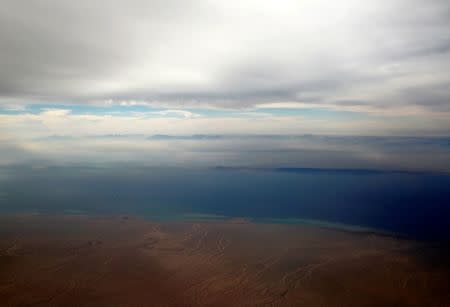 FILE PHOTO: An aerial view of the coast of the Red Sea and the two islands of Tiran and Sanafir is pictured through the window of an airplane near Sharm el-Sheikh, Egypt November 1, 2016. REUTERS/Amr Abdallah Dalsh