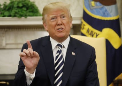 FILE PHOTO: U.S. President Donald Trump speaks during his Oval Office meeting with French President Emmanuel Macron (not pictured) following the official arrival ceremony for Macron at the White House in Washington, U.S., April 24, 2018. REUTERS/Kevin Lamarque