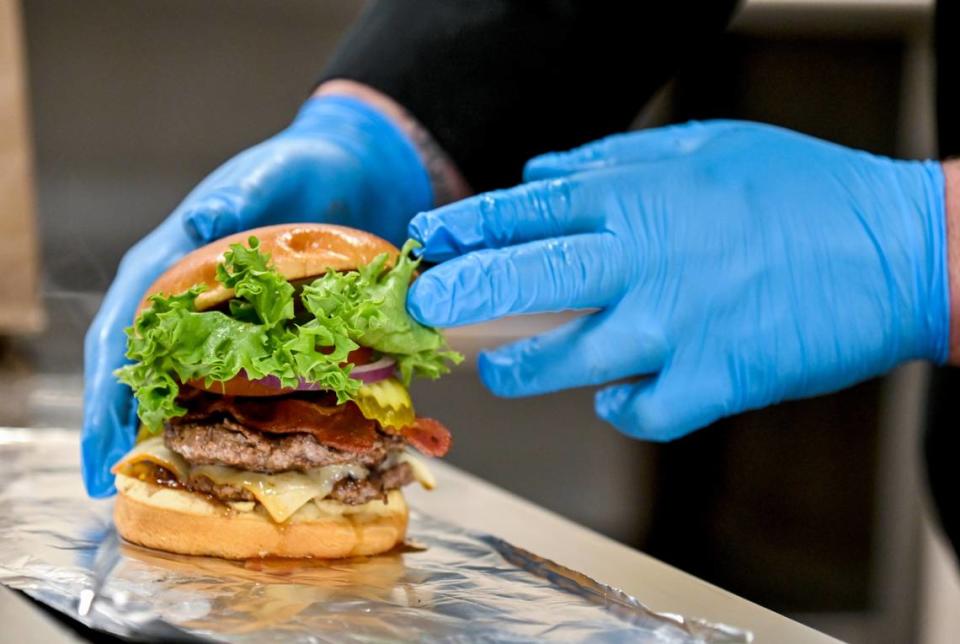 The “Keene’s Famous” steak burger at Keene’s Kafe includes two Angus steak patties, muenster cheese, bacon, lettuce, red onion and pickles on a brioche bun along with a side of fries.