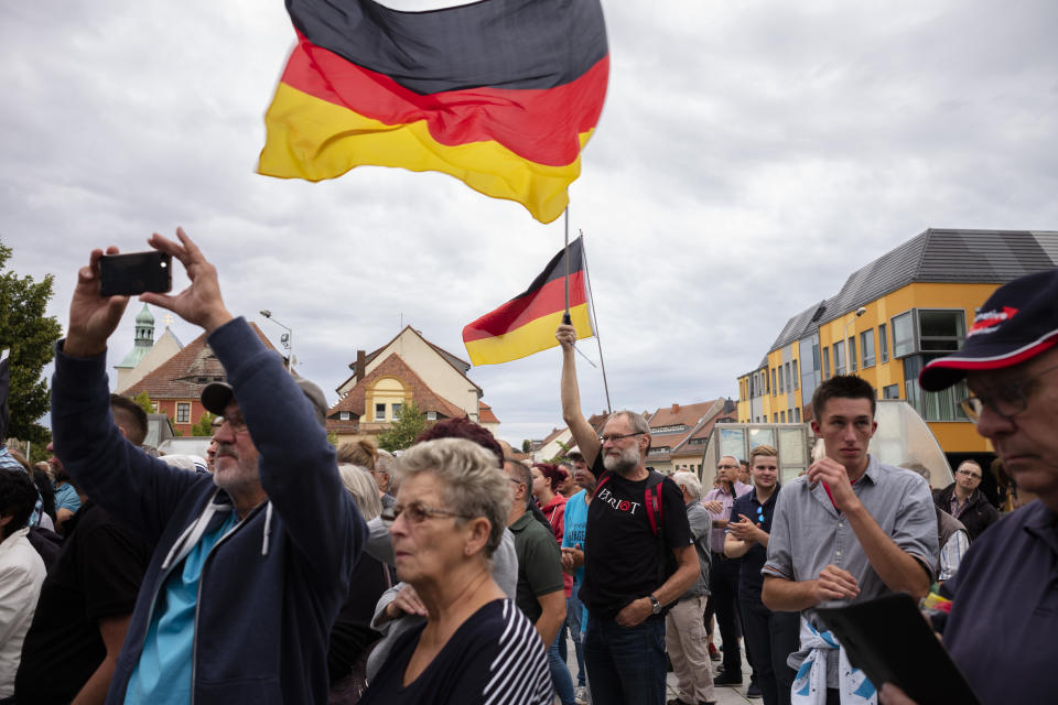 FILE - In this Thursday, Aug. 15, 2019 file photo, a crowd of people attend an election campaign rally of German Alternative for Germany, AfD, party for the Saxony state elections in Bautzen, Germany. Migration is a side issue in this year's German election campaign for the national elections on Sept. 26, but that hasn't stopped the country's biggest far-right party from trying to play it up. (AP Photo/Markus Schreiber, file)