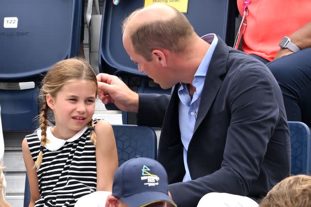 <p>Karwai Tang/WireImage</p> Prince William and Princess Charlotte attend the 2022 Commonwealth Games.