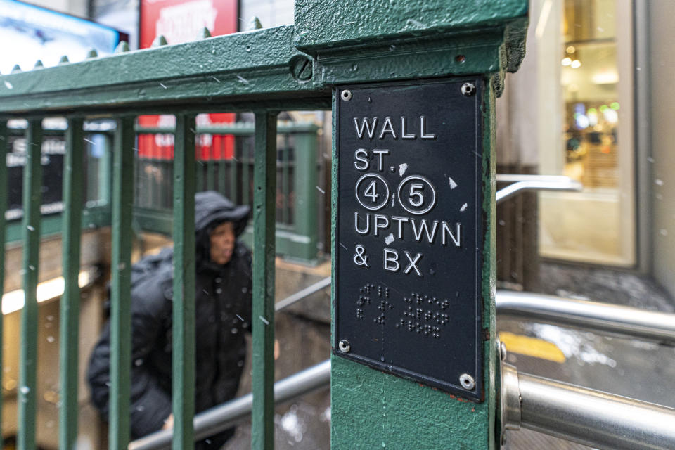 A person departs the Wall Street subway station on Friday, Jan. 19, 2024, in New York. Wall Street is rising Friday and may break past its all-time high set two years ago, before the highest inflation and interest rates in decades sent financial markets tanking worldwide. (AP Photo/Peter K. Afriyie)