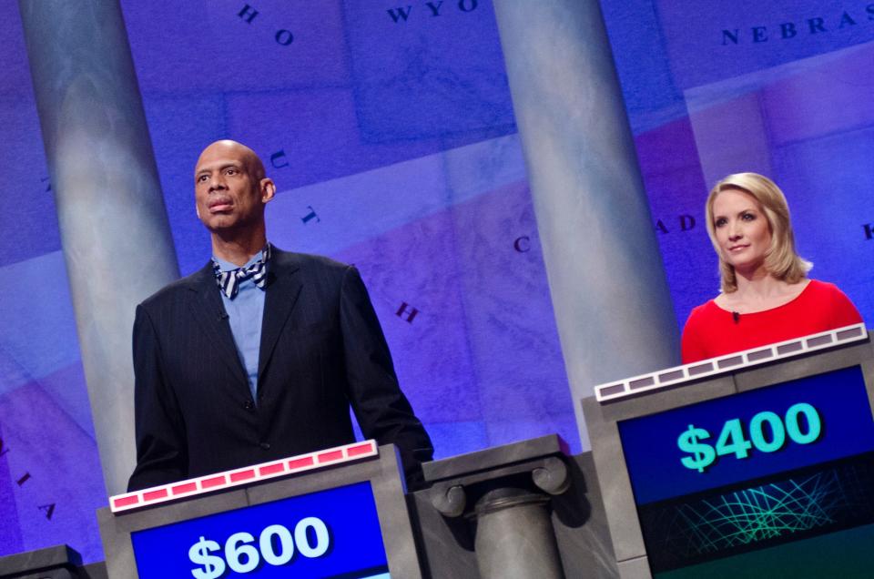 Kareem Abdul-Jabbar and Dana Perino speak during a rehearsal before a taping of Jeopardy! Power Players Week at DAR Constitution Hall on April 21, 2012 in Washington, DC.