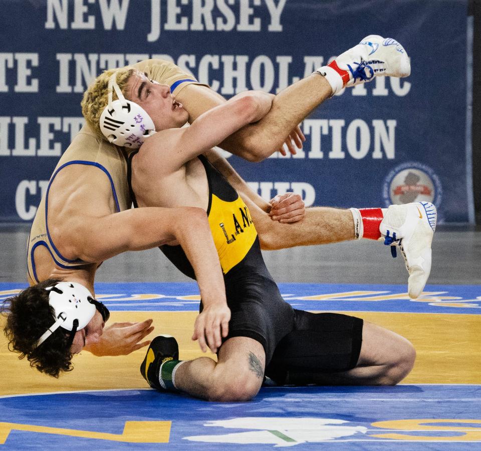 St. John Vianney's Anthony Knox (right) defeated Donovan Catholic's Kurt Wehner 15-8 in the NJSIAA 120-pound final.