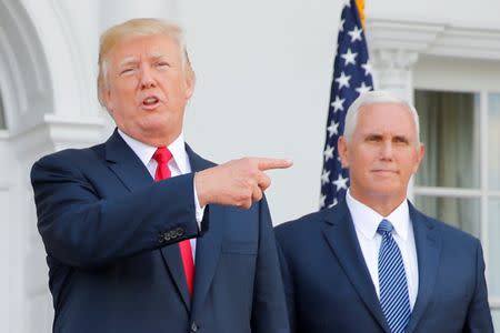 U.S. President Donald Trump speaks to reporters with Vice President Mike Pence at his side at Trump's golf estate in Bedminster, New Jersey U.S. August 10, 2017. REUTERS/Jonathan Ernst