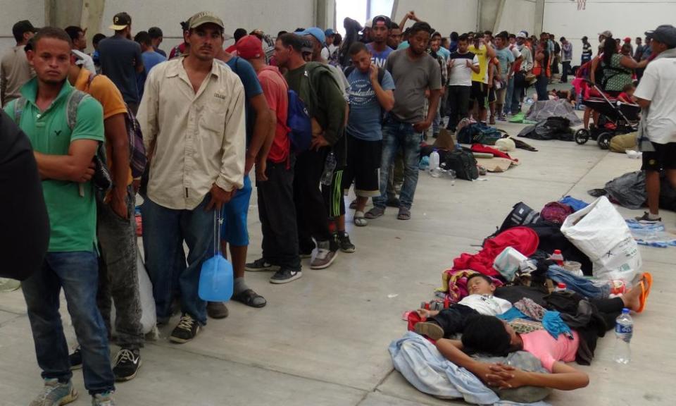 Central American migrants gather before continuing their journey to the US in Ixtepec, Mexico.