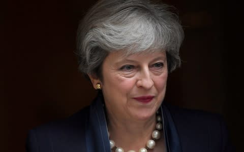 Theresa May is looking at cutting interest rates on student loans - Credit: Reuters