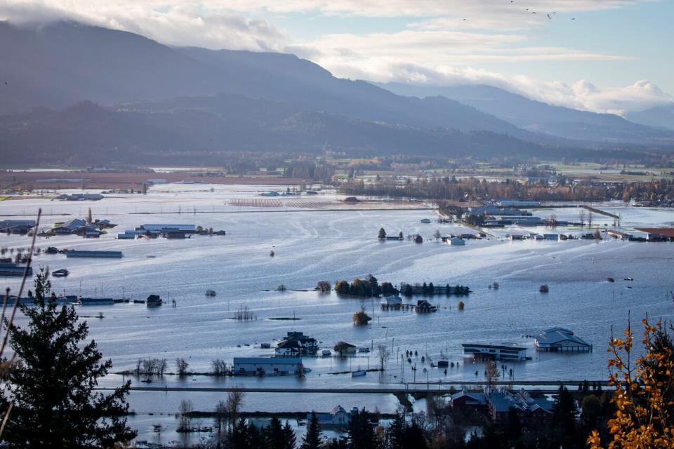 Homes and farm land in the community of Sumas Prairie is pictured underwater during flooding in Abbotsford, British Columbia on November 16, 2021. 