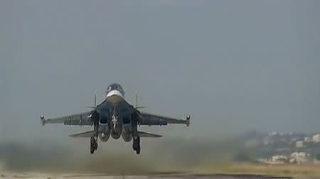 A still image taken from video footage, released by Russia's Defence Ministry on November 19, 2015, shows a Russian military jet taking off at Hmeimim airbase in Syria. REUTERS/Ministry of Defence of the Russian Federation/Handout via Reuters