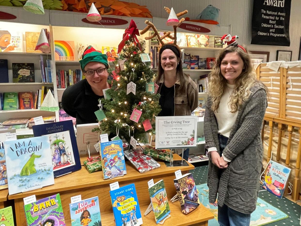 McLean and Eakin Booksellers hosts their annual The Giving Tree program during which shoppers can shop for and donate books to be given to children staying at the Women’s Resource Center of Northern Michigan’s Safe Home. Pictured around the tree are (from left) McLean and Eakin General Manager Zach Matelski and booksellers Maris Herrington and Katie Pionk.