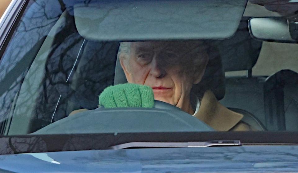 King is pictured driving around his Sandringham Estate (Paul Marriott)