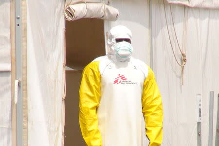 A Doctors Without Borders health worker stands in an Ebola virus treatment center in Conakry, Guinea, November 17, 2015. REUTERS/Saliou Samb