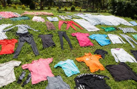 Laundry is aired to dry on a grass at the Agahozo-Shalom Youth Village (ASYV) built to rehabilitate children who lost their families in the 1994 Rwandan genocide, in Rwamagana, Eastern Province of Rwanda April 1, 2019. Picture taken April 1, 2019. REUTERS/Jean Bizimana