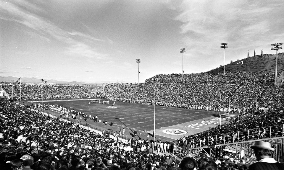 Arizona State University faced Florida State on Dec. 27, 1971, in the first Fiesta Bowl at Sun Devil Stadium. ASU, which featured Danny White as quarterback, won 45-38. Attendance was 51,098 with Frank Kush coaching the Sun Devils. The payout per team was $168,237 and included players such as Quarterback Danny White, running back Woody Green and stand-out defensive player Junior Ah You.
