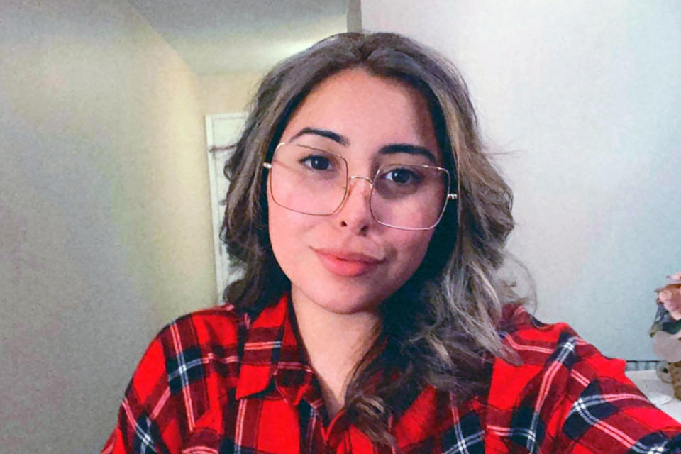 In this photo provided by Naihla De Jesus, De Jesus poses for a selfie in her Santa Clara County, California, home, Wednesday, July 14, 2021. De Jesus entered California's foster care system when she was 17. Now 24, she works full-time and cares for her 9-year-old brother. She has been receiving $1,000 per month from Santa Clara County since September, part of a guaranteed income program targeting former foster care children. On Thursday, July 15, California lawmakers are scheduled to vote on a bill that would authorize funding for similar guaranteed income programs thought the state. It would be the first guaranteed income program funded at the state level. (Naihla De Jesus via AP)