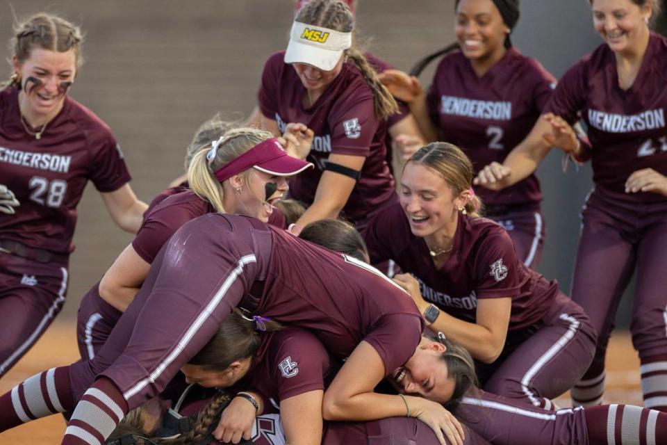 Henderson County players celebrate after winning the state softball championship at John Cropp Stadium on Saturday.