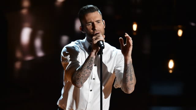 Adam Levine has a new 'do for summer. The sexy Maroon 5 frontman debuted his shaved head in an Instagram selfie with his wife Behati Prinsloo. "She's into me," he wrote early Tuesday morning. "I think..." <strong> WATCH: Adam Levine Bares His Butt in Maroon 5's Sexiest Video Yet! </strong> This wouldn't be the first time Levine has shocked his fans with a drastic change to his image. This past April, <em>The Voice</em> mentor took a chance and let his 26-year-old supermodel wife cut his hair. <strong> WATCH: Adam Levine Sugar-Bombed Outside <em>Jimmy Kimmel Live </em></strong> "Give me them scissors!" Prinsloo captioned the pic of her trimming her husband's hair. In May 2014, the 36-year-old rocker also decided see if blonds have more fun. "Apocalypse prep course complete," Levine captioned the selfie of his lighter locks. Apocalypse prep course complete. pic.twitter.com/muvPDrIa59— Adam Levine (@adamlevine) May 3, 2014 <strong>What do you think of Levine's buzz cut?</strong>