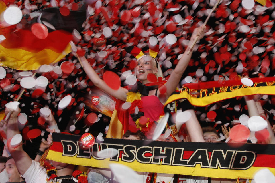 BERLIN, GERMANY - JUNE 13: German soccer fans cheer during the match of their team's second match during the UEFA EURO 2012 group B match between Netherlands and Germany at a public viewing zone called 'fan mile' near the Brandenburg Gate on June 13, 2012 in Berlin, Germany. Germany won 2:1 versus Netherlands. (Photo by Andreas Rentz/Getty Images)