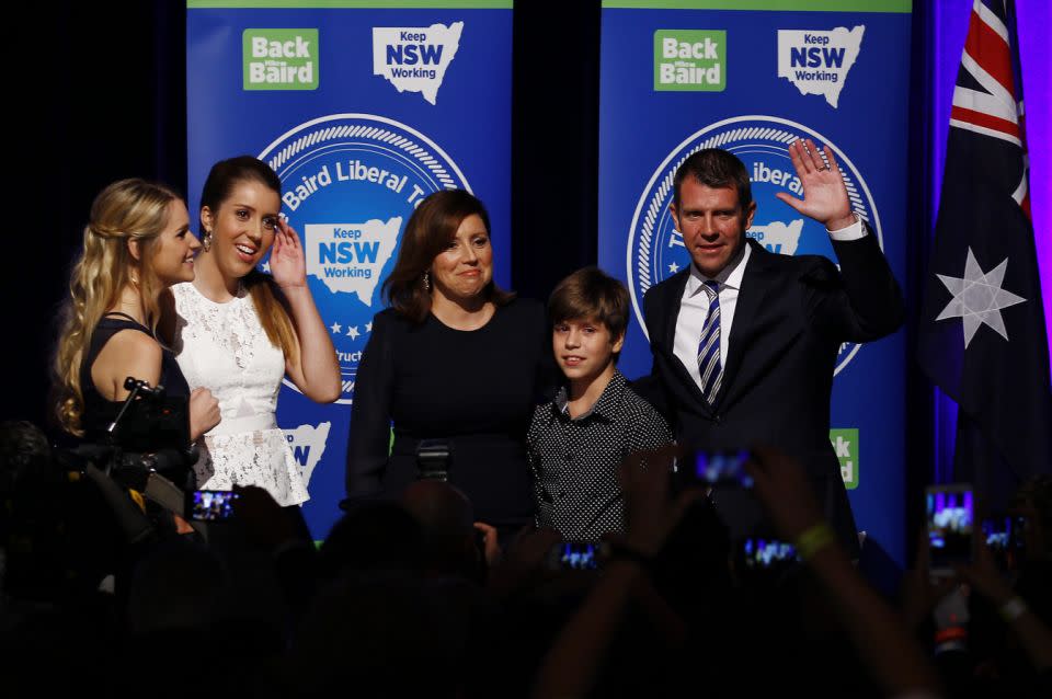 Mike Baird with his wife Kerryn and children Cate (second left), Laura and Luke on stage after winning the 2015 election. Photo: AAP