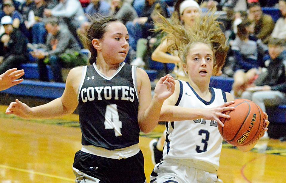 Great Plains Lutheran's Kaitlyn Rawerts (3) drives against Waverly-South Shore's Brianna Gottschalk during a high school boys-girls basketball doubleheader on Thursday, Feb. 16, 2023 in Watertown.