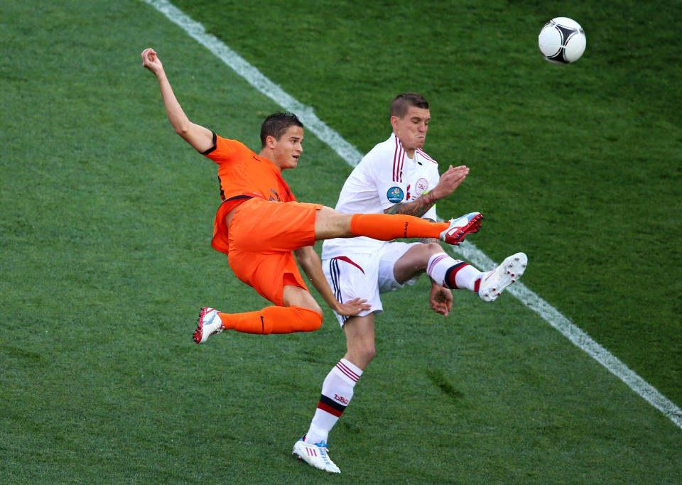 KHARKOV, UKRAINE - JUNE 09: Ibrahim Afellay of Netherlands and Daniel Agger of Denmark compete for the ball during the UEFA EURO 2012 group B match between Netherlands and Denmark at Metalist Stadium on June 9, 2012 in Kharkov, Ukraine. (Photo by Julian Finney/Getty Images)