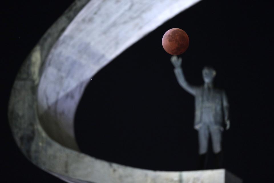 The moon is shown in eclipse in Brasilia April 15, 2014. The lunar eclipse on Tuesday will unfold over three hours when the moon begins moving into Earth's shadow. A little more than an hour later, the moon will be fully eclipsed and shrouded in an orange, red or brown glow. REUTERS / Ueslei Marcelino (BRAZIL - Tags: ENVIRONMENT SCIENCE TECHNOLOGY TPX IMAGES OF THE DAY)