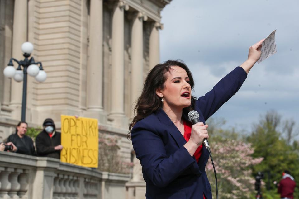 Outside the state Capitol, Rep. Savannah Maddox, R-Dry Ridge, shows support for protesters who wanted Kentucky to reopen during the pandemic. Gov. Andy Beshear was giving his daily COVID-19 update at the time. More than 100 people protested. April 15, 2020