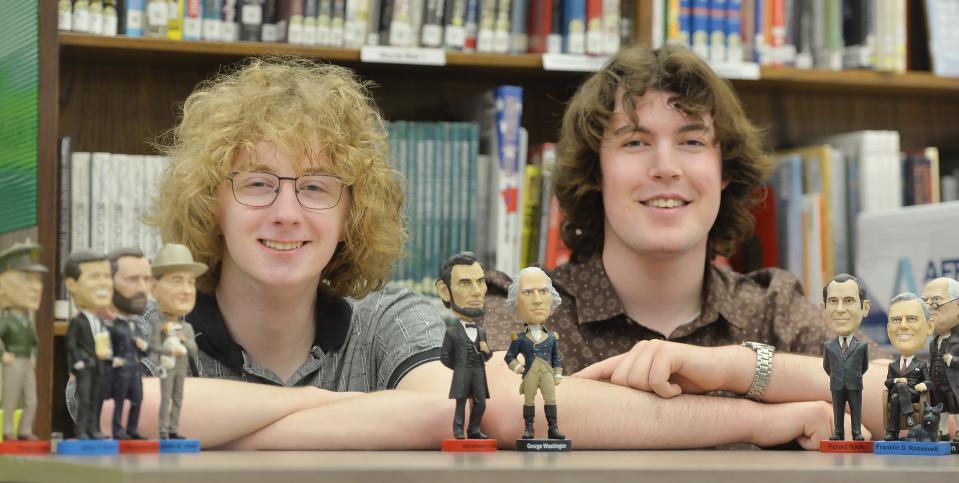 Fairview High School seniors, and best friends, Adam Chiocco, left, and Anthony Cimino, will both attend Harvard University in the fall. The students, interested in politics, are shown in the school's library with a few bobblehead presidents.