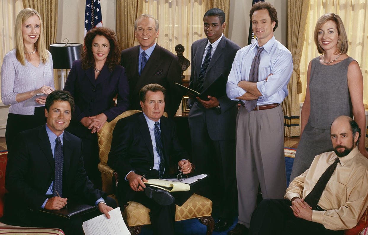 ‘The West Wing’ (Front Row) Rob Lowe, Martin Sheen, Richard Schiff. (Back Row) Janel Moloney, Stockard Channing, John Spencer, Dule Hill, Bradley Whitford and Allison Janney. (© Warner Bros. Entertainment, Inc.)