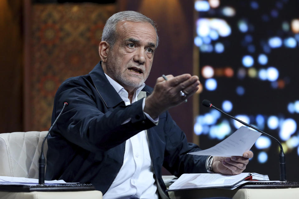 In this picture made available by Iranian state-run TV, IRIB, reformist presidential candidate for the June 28 election, Masoud Pezeshkian speaks in a debate of the candidates at the TV studio in Tehran, Iran, Monday, June 17, 2024. (Morteza Fakhri Nezhad/IRIB via AP)