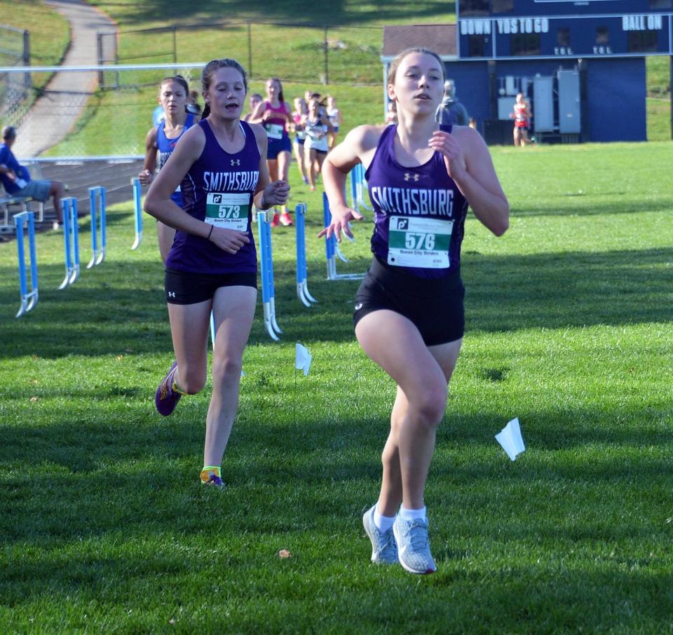 Smithsburg sophomore Kayla Hawbecker (576) and  sophomore Cora Gentzel (573) compete in the Maryland Class 1A West region girls cross country race at Catoctin on Nov. 3, 2022. Hawbecker finished sixth and Gentzel placed 12th.