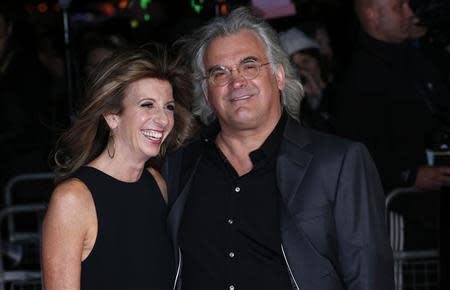 Director Paul Greengrass and Joanna Greengrass arrive for the European premiere of "Captain Phillips", on the opening night of the London Film Festival, at the Odeon Leicester Square in central London October 9, 2013. REUTERS/Suzanne Plunkett