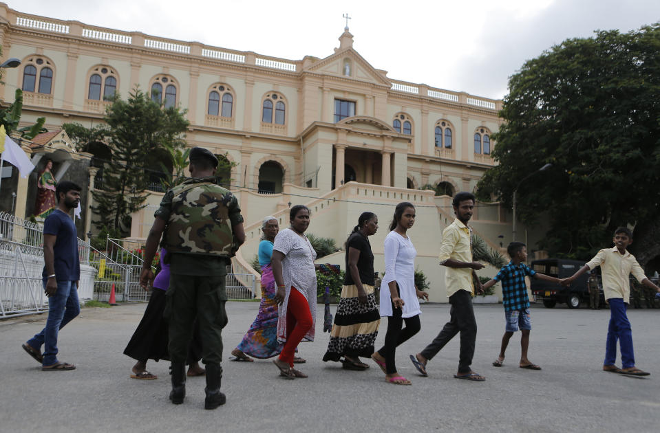 In this Sunday, May 12, 2019, photo, Sri Lankans walk past Good Shepherd convent in Colombo, Sri Lanka. Catholic officials and parents in Sri Lanka are hopeful that church-run schools will begin to reopen soon for the first time since April’s devastating Easter Sunday attacks on churches and hotels. (AP Photo/Eranga Jayawardena)