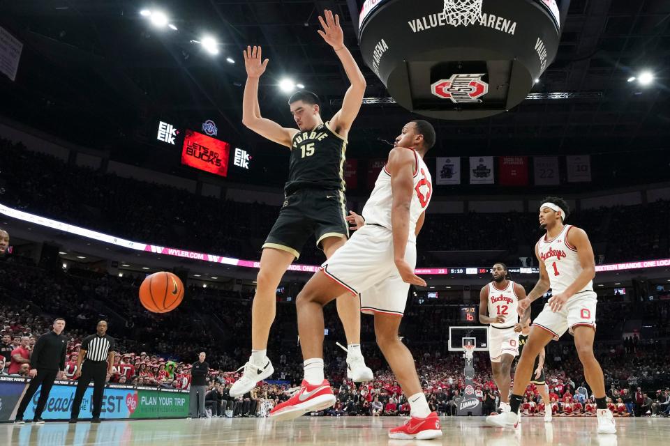 Feb 18, 2024; Columbus, Ohio, USA; Ohio State Buckeyes forward Zed Key (23) strips the ball from Purdue Boilermakers center Zach Edey (15) during the first half of the NCAA men’s basketball game at Value City Arena. Ohio State won 73-69.