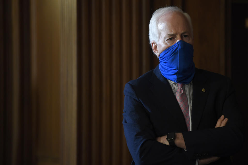 Sen. John Cornyn, R-Texas, listens during a news conference on Capitol Hill in Washington, Monday, July 27, 2020, to highlight the new Republican coronavirus aid package. (AP Photo/Susan Walsh)