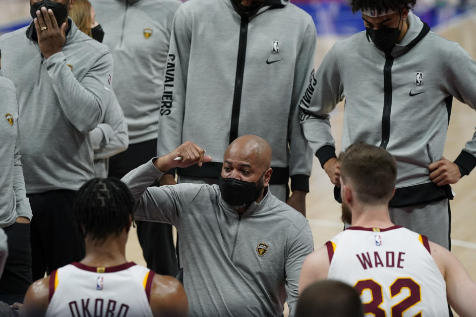 Cleveland Cavaliers head coach J.B. Bickerstaff talks to his team during the first half of an NBA basketball game against the Detroit Pistons, Monday, April 19, 2021, in Detroit. (AP Photo/Carlos Osorio)