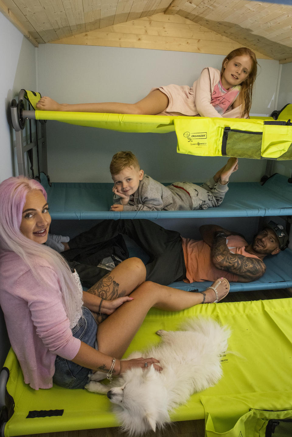 These pictures show a family of four who paid £500 to spent the night in a PLAYHOUSE - that was posted on Airbnb as a joke. Ollie and Kady Hammond had a 'mini break' on Saturday eve in the child's toy house - with their kids Beau, five, and Brooke, ten. They snapped up the booking after it was posted as a prank by Jason Kneen, 49. He built the 8ft (2.4m) by 6ft (1.8m) structure in his garden during lockdown. The dad-of-five then advertised it on the popular travel website for a laugh - but didn't actually think anyone would stump up to stay.