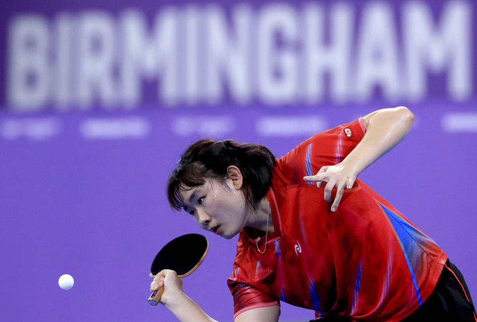Malaysia's Li Sian Alice Chang plays a shot against Wales' Charlotte Carey during the Women's Table Tennis Team Semi-Final match between Malaysia and Wales at The NEC on day three of the Commonwealth Games in Birmingham, England, Sunday July 31, 2022. (Bradley Collyer/PA via AP)